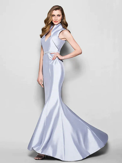 Woman posing in the sleeveless Mother of the Bride gown, showcasing its full length.