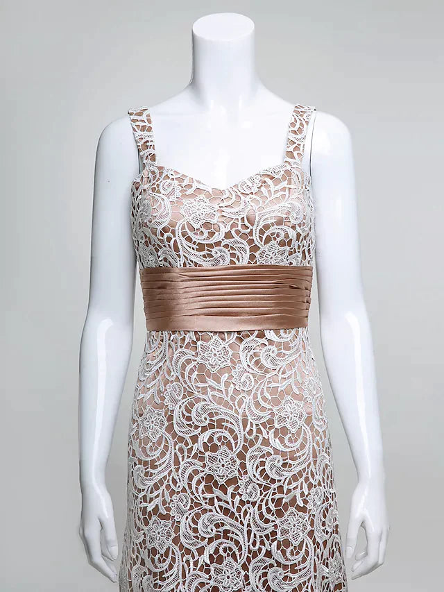 Model posing in the long Mother of the Bride gown, highlighting the lace bodice and flowing skirt.