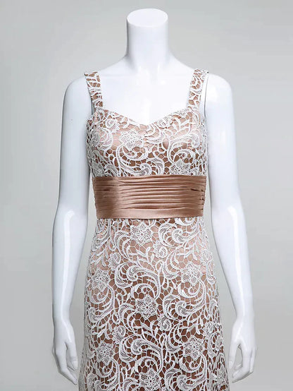 Model posing in the long Mother of the Bride gown, highlighting the lace bodice and flowing skirt.
