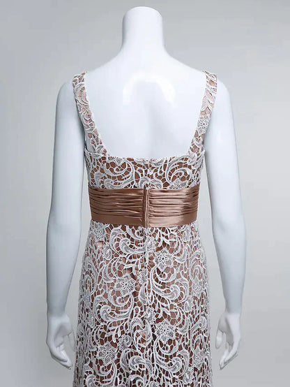Close-up of the delicate lace and ruched detailing on the bodice of the formal dress.