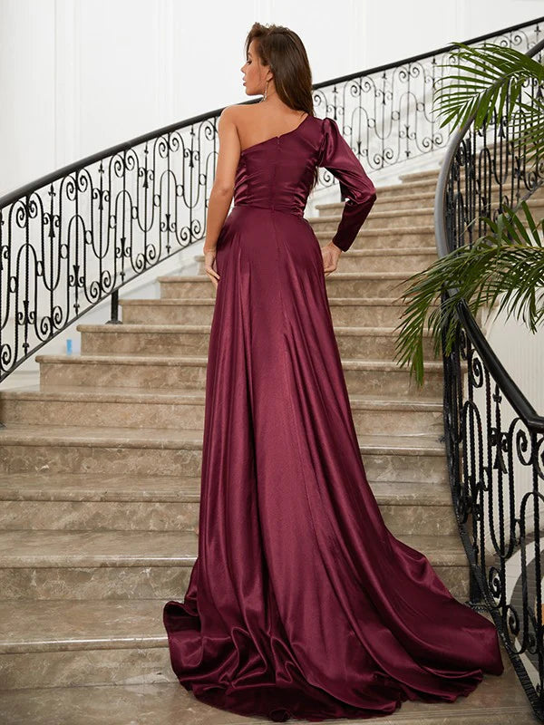 Side view of an elegant navy blue satin one-shoulder long sleeve prom dress.
