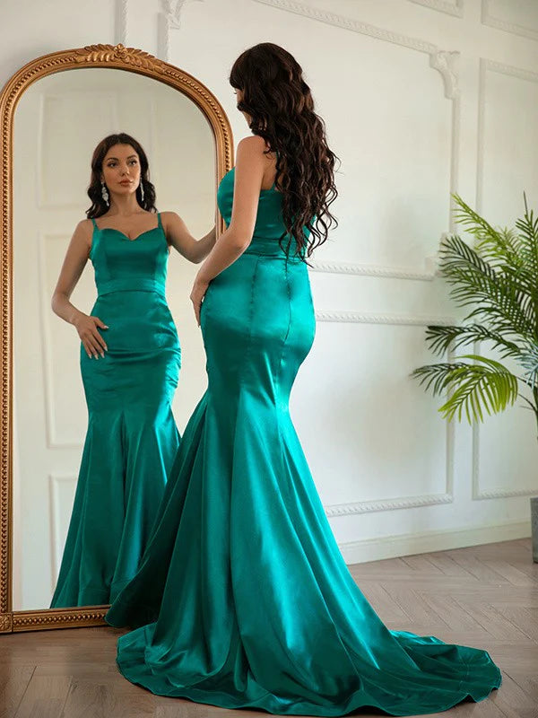 Side view of the flowing ruched V-neck satin prom dress.