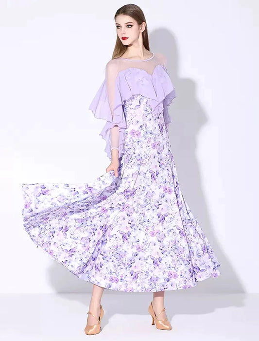 Woman posing in an elegant long sleeve ruffled printed ballroom dance dress.
