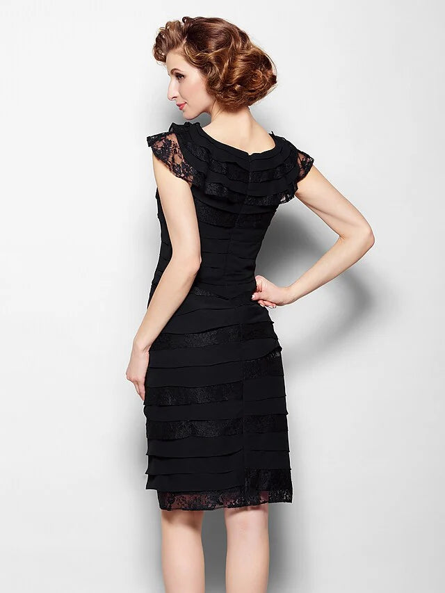 Back view of the black knee-length Mother of the Bride dress.