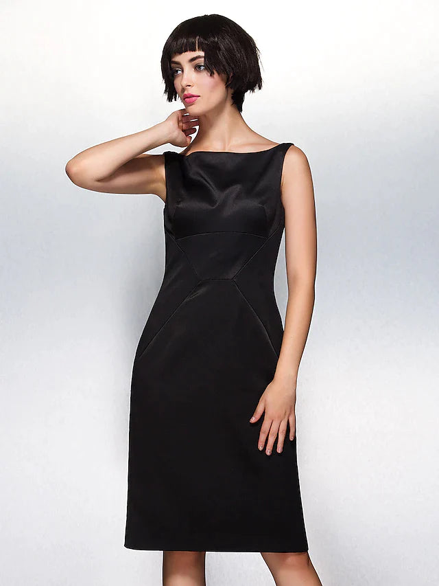 Woman wearing a dark blue satin sheath dress with a bateau neckline.