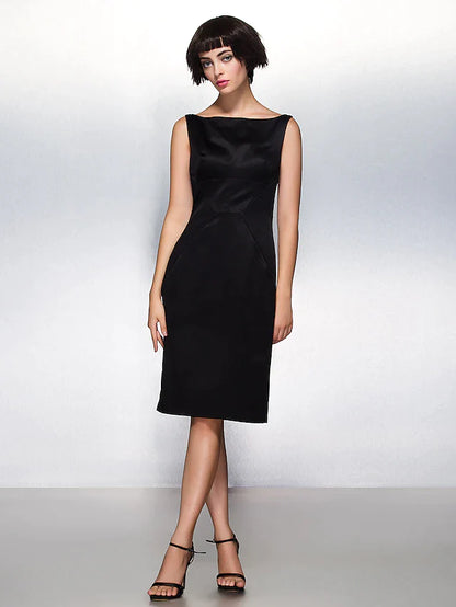 Close-up of the bateau neckline and bodice of a dark blue satin sheath dress.