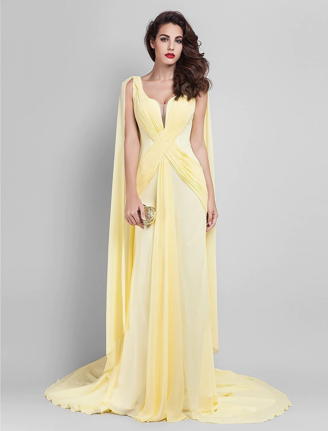 Model walking in the Georgette dress, highlighting the court train.