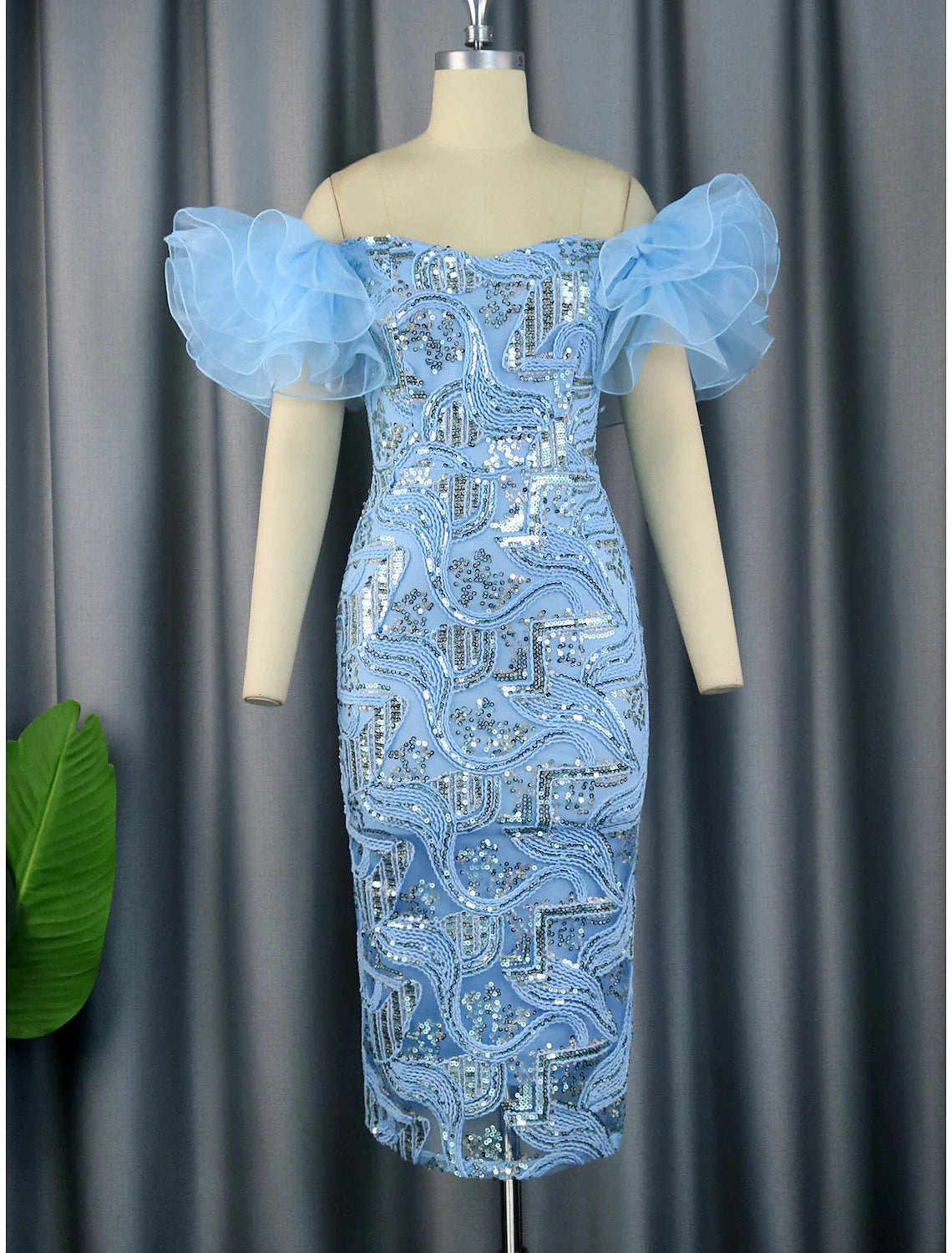 Model wearing an elegant floral sequined off-shoulder tea-length party dress.