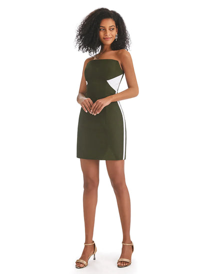 Woman wearing an elegant strapless color block mini dress with fringe.