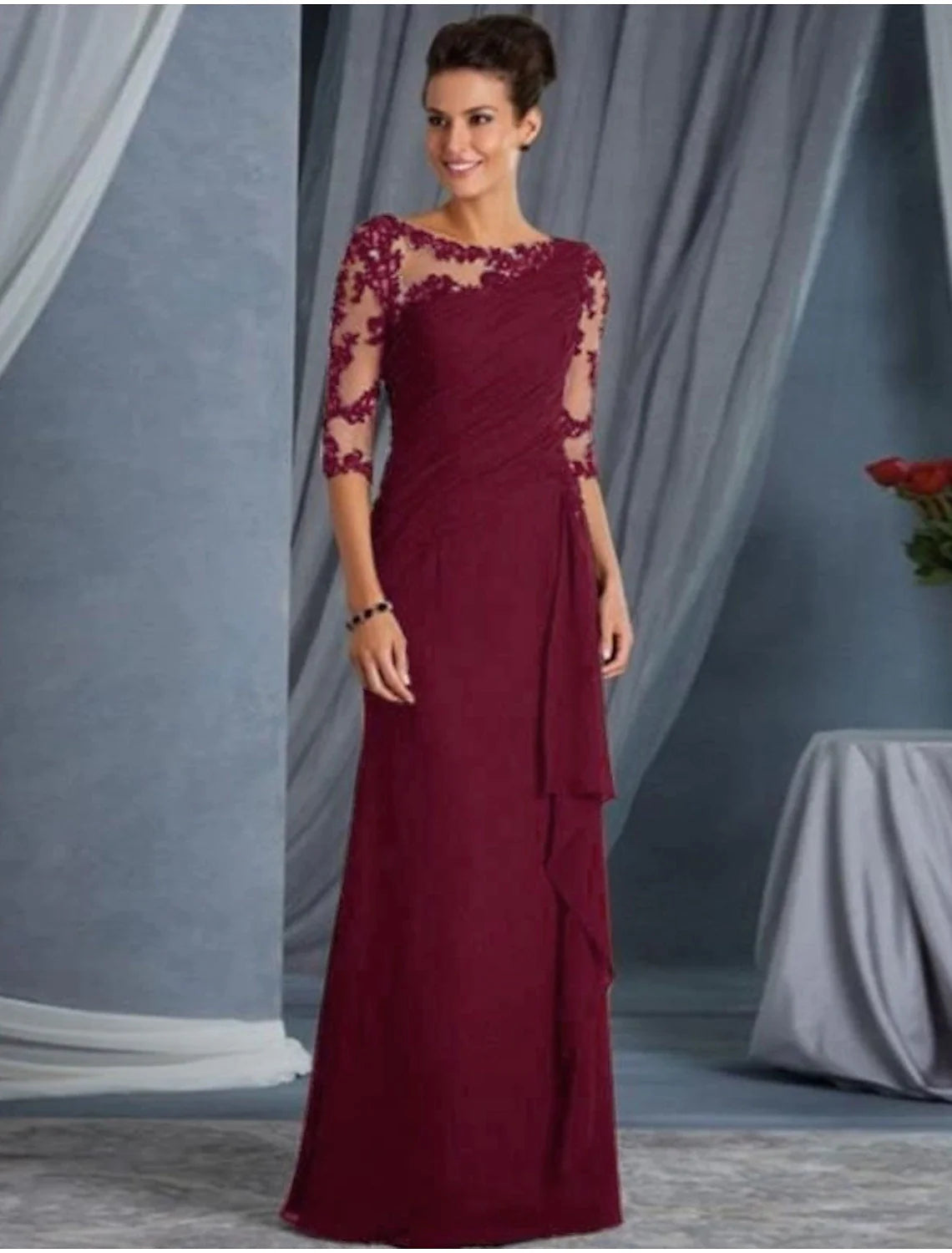 Back view of the floor-length black formal dress with appliques.