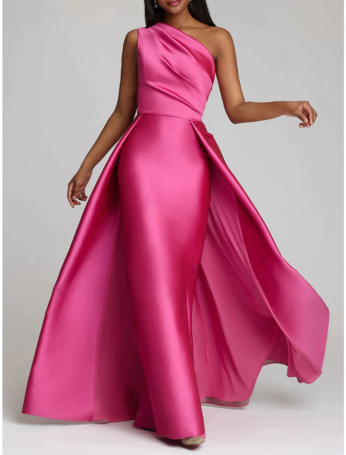 Model wearing a red one-shoulder satin sheath gown with an overskirt.