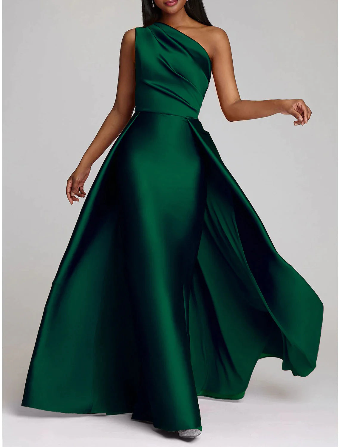 Close-up of the one-shoulder neckline and satin fabric of the gown.