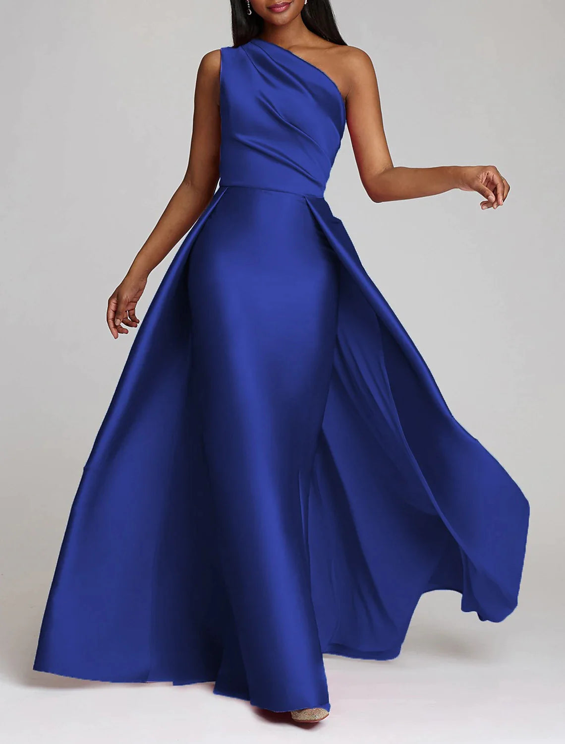 Back view of the elegant floor-length satin gown with overskirt.