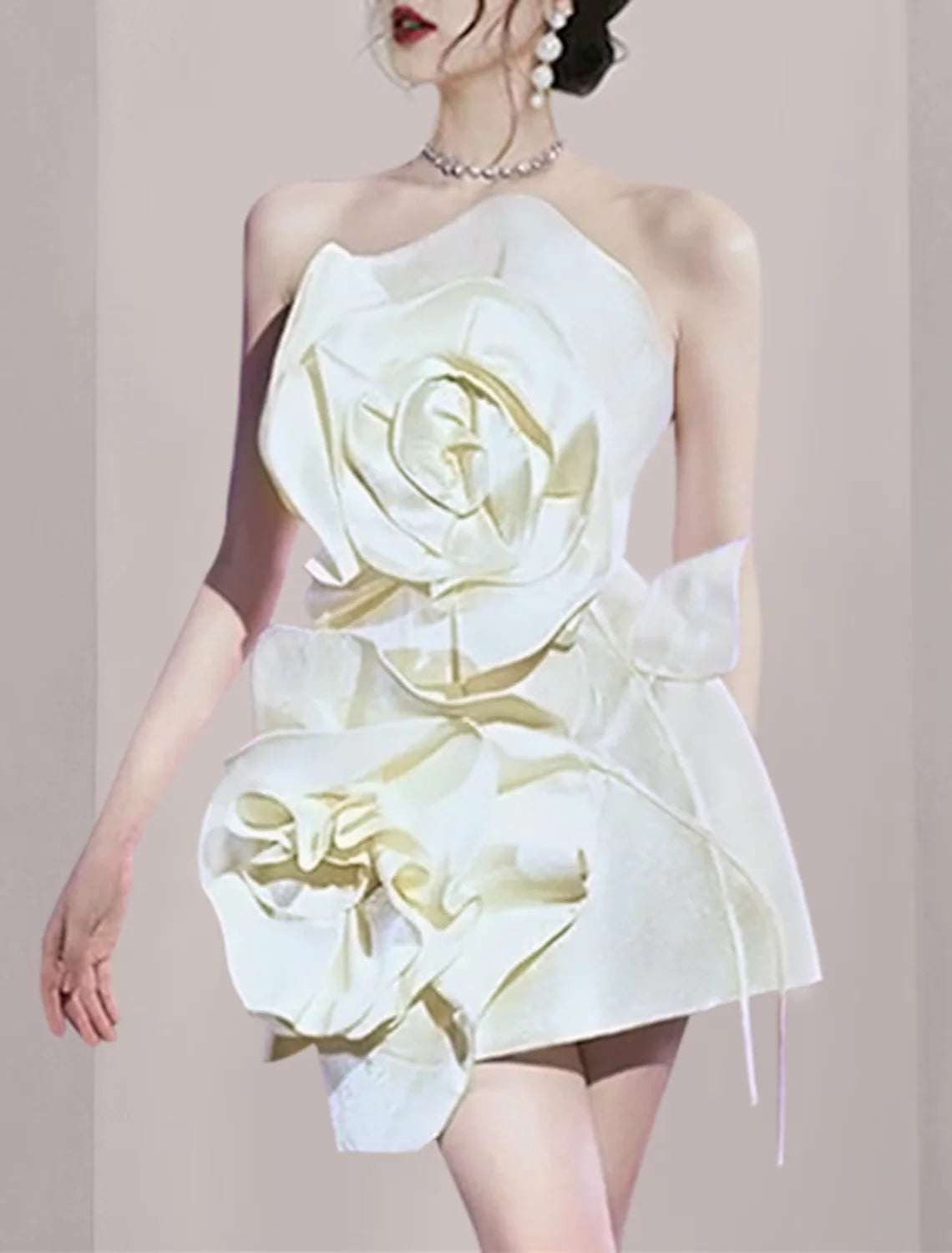 Model wearing a strapless floral satin short homecoming dress with ruffles.