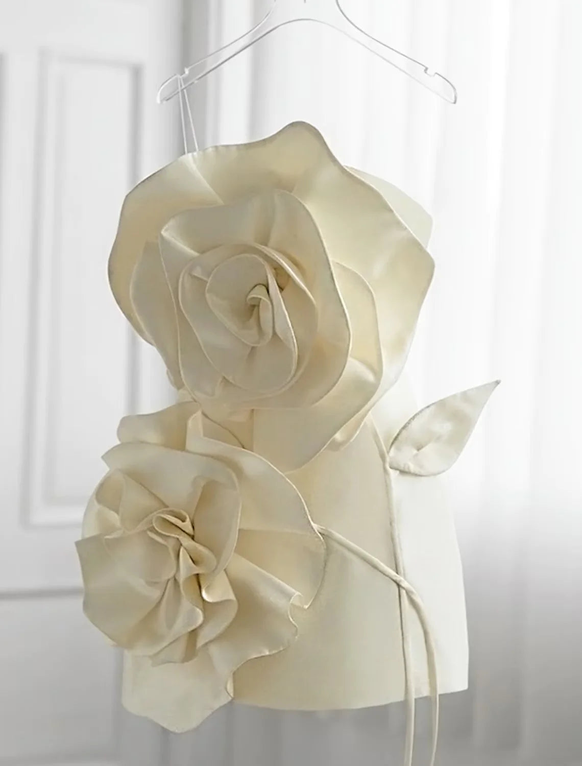 Back view of a strapless sheath dress with floral print.