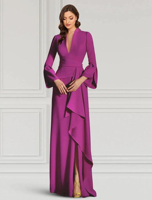 Woman in an elegant black sheath V-neck long-sleeve evening gown with ruffles.