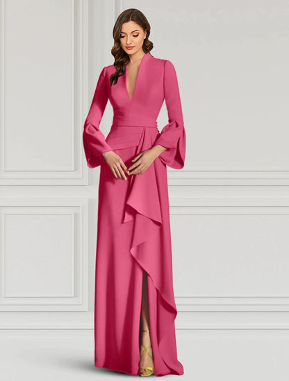 Full-length view of a woman in a black evening gown, emphasizing its formal style.