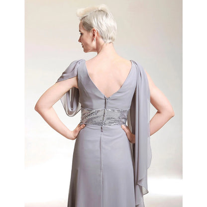 Side profile of the elegant sheath chiffon gown, highlighting its flowing silhouette.