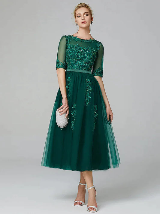 Model wearing a sparkle A-line tea-length formal dress with illusion neck and sequin lace.
