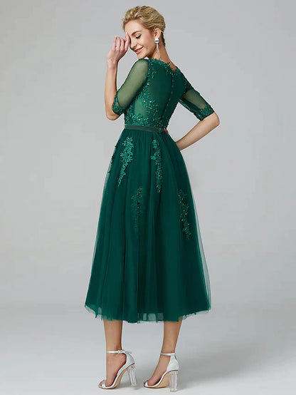 Back view of the A-line sparkle dress, showing lace and tulle details.