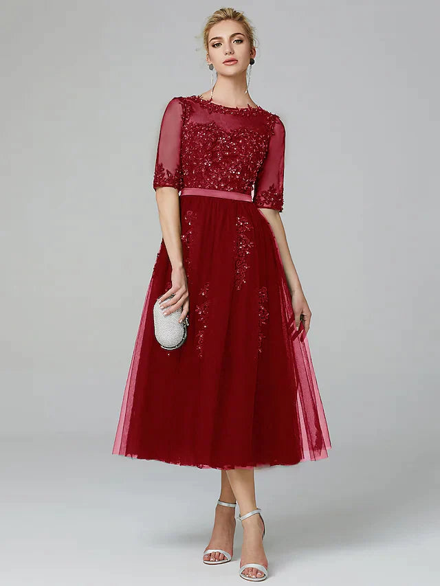 Full length view of the sleeveless A-line formal evening gown.