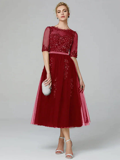 Full length view of the sleeveless A-line formal evening gown.