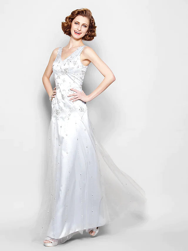 Back view of the sleeveless sparkle Mother of the Bride gown with lace details.