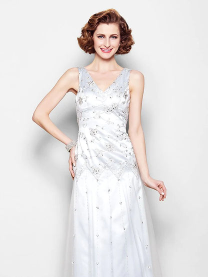 Close-up of the V-neckline and intricate beading on the Mother of the Bride dress.