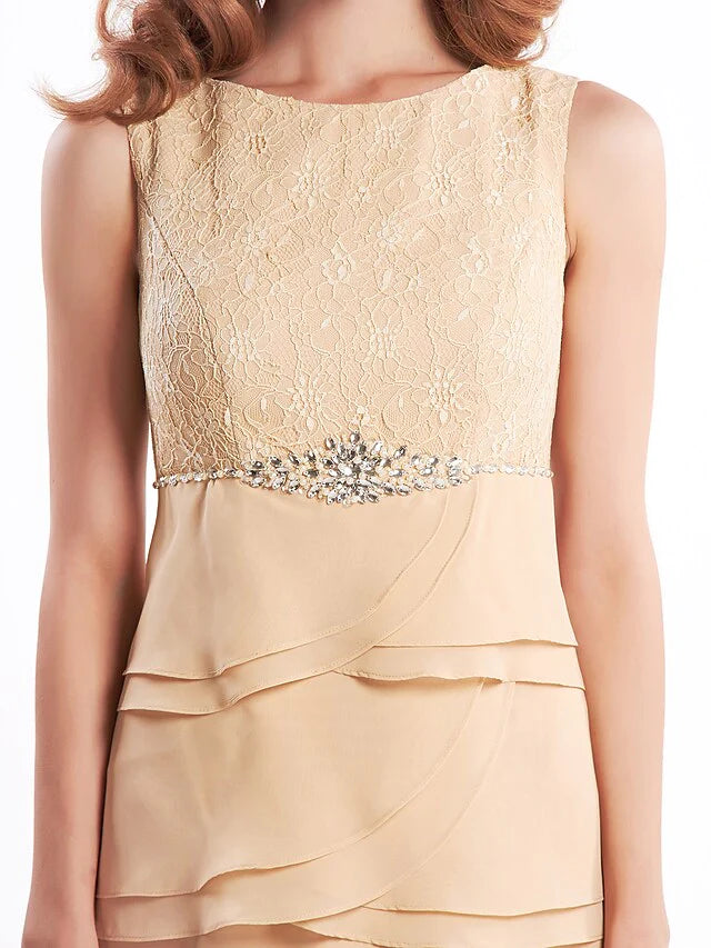 Close-up of the sparkling crystal embellishments on the bodice of the strapless chiffon dress.