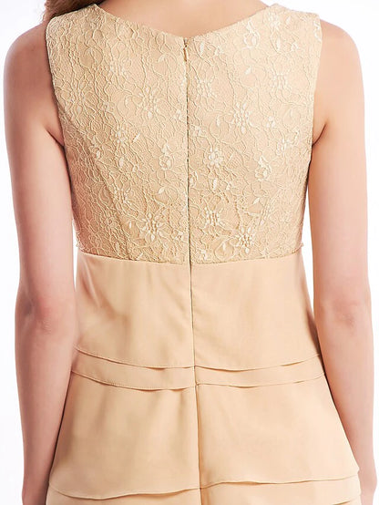 Full view of the strapless chiffon dress, emphasizing its elegant knee-length cut and flowing fabric.