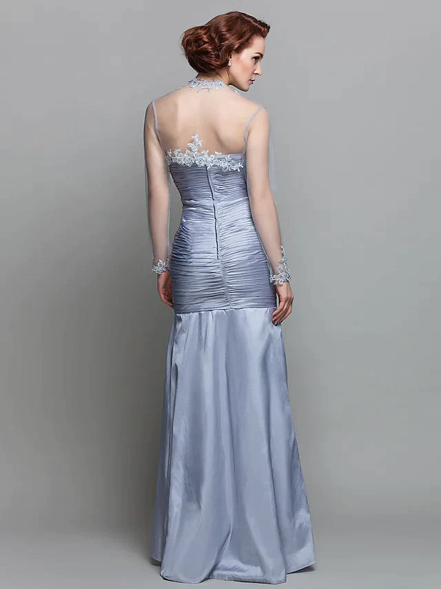 Close-up of the ruched bodice and delicate beading appliques on the dress.