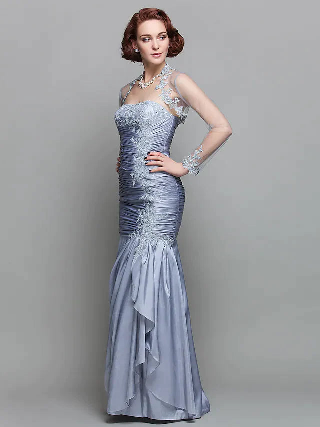 Side profile of the dark blue strapless gown, showcasing its elegant silhouette.