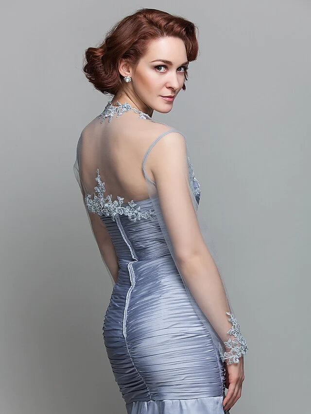 Model wearing the Mother of the Bride dress, highlighting the versatile long-sleeve wrap.
