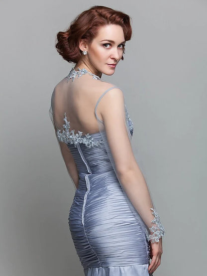 Model wearing the Mother of the Bride dress, highlighting the versatile long-sleeve wrap.