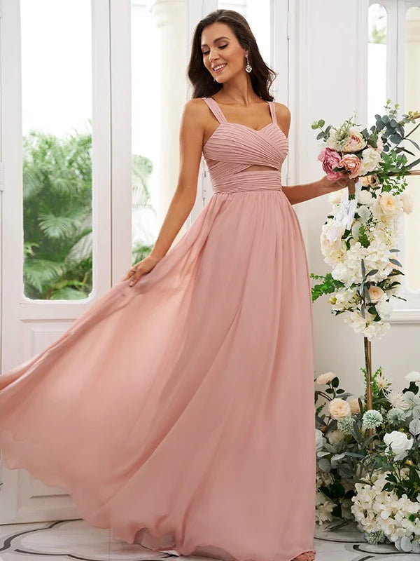 Woman wearing an elegant light blue one-shoulder ruched bridesmaid dress.