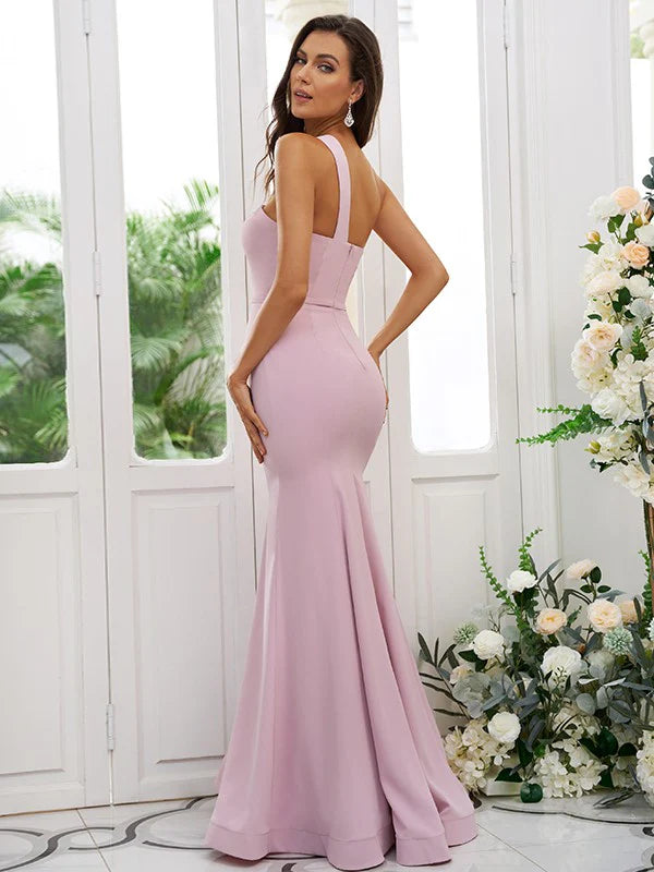 Back view of a dark blue floor-length bridesmaid dress with one-shoulder design.