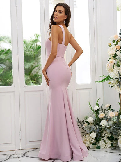 Back view of a dark blue floor-length bridesmaid dress with one-shoulder design.