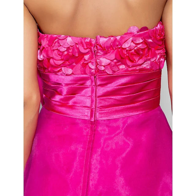 Side profile of the model in the sweetheart neckline knee-length dress.