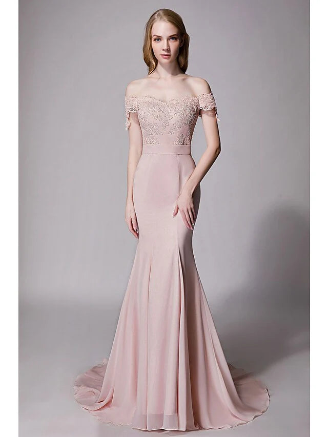 Woman wearing a soft blue sweetheart chiffon lace bridesmaid dress with a court train and sash ribbon.