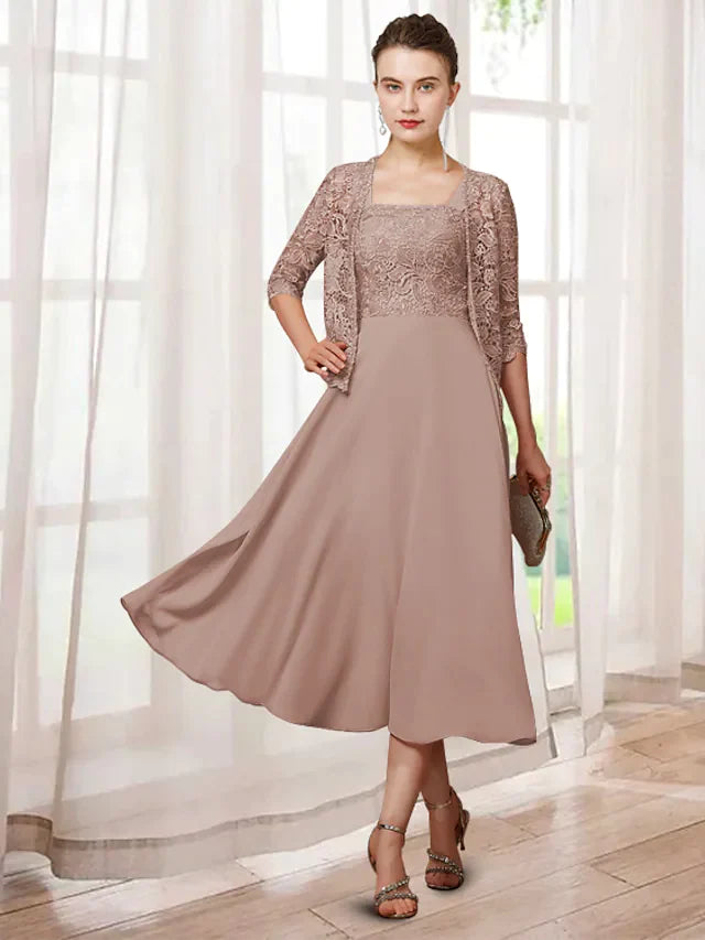 Elegant two-piece A-line mother of the bride dress with jewel neck and half sleeves.