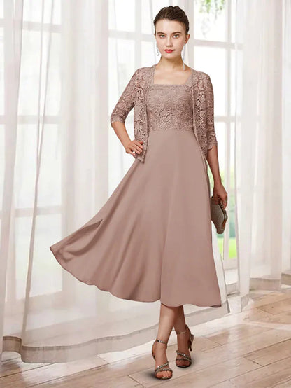 Elegant two-piece A-line mother of the bride dress with jewel neck and half sleeves.