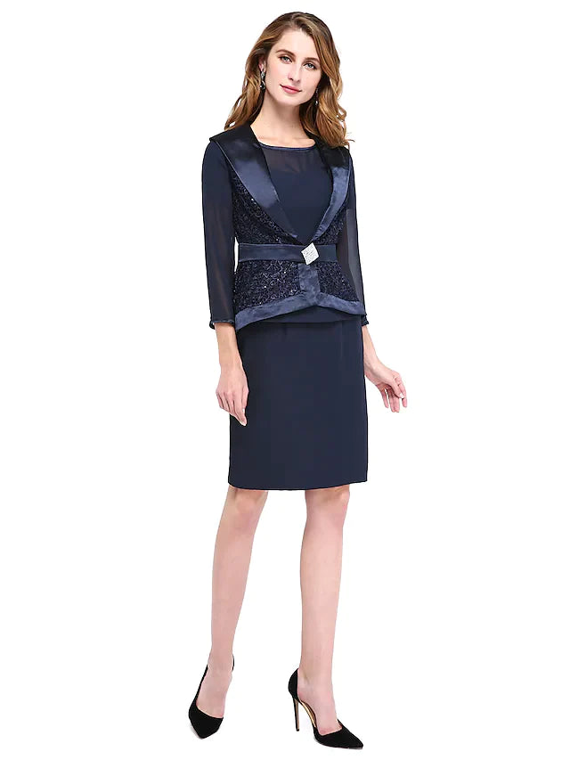 Model wearing an elegant two-piece chiffon lace Mother of the Bride dress with a jewel neck and long sleeves.