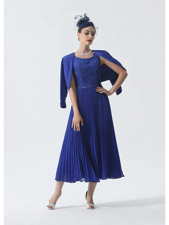 Elegant two-piece mother of the bride dress with scoop neck, 3/4 sleeves, and a matching wrap.
