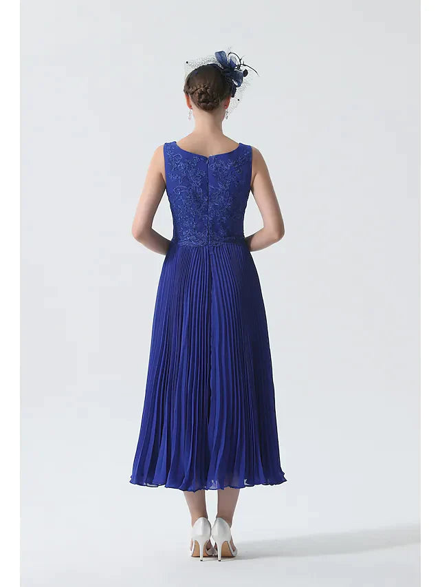 Close-up of the scoop neck and 3/4 length sleeves with lace details on the elegant dress.