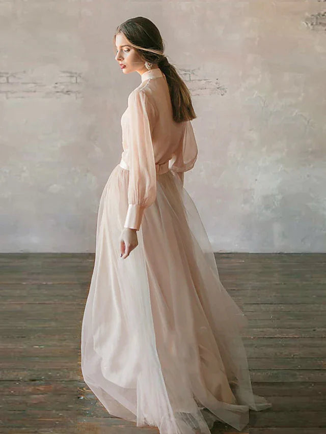 Side view of model wearing a tiered chiffon formal dress.