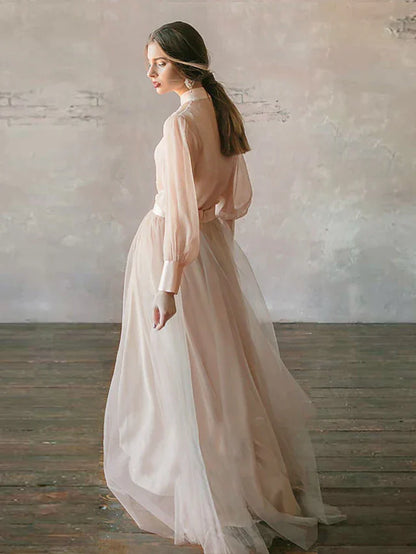 Side view of model wearing a tiered chiffon formal dress.