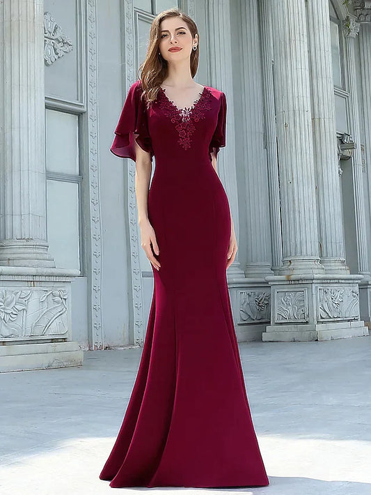 Elegant V-neck floor-length chiffon bridesmaid dress in light blue on a model.
