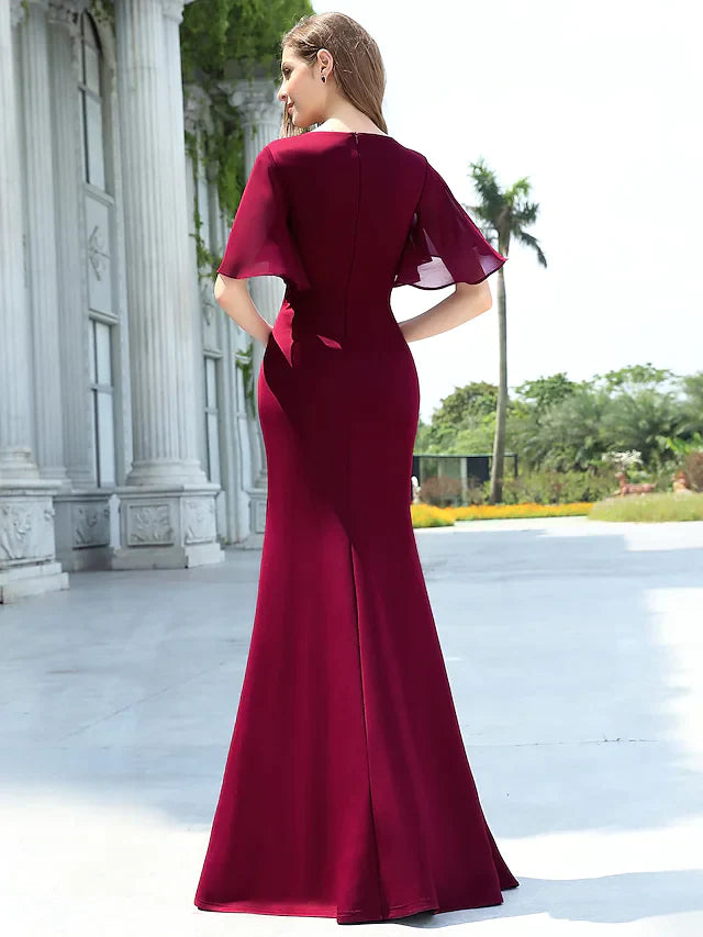 Side view of a model wearing the light blue V-neck chiffon bridesmaid gown.