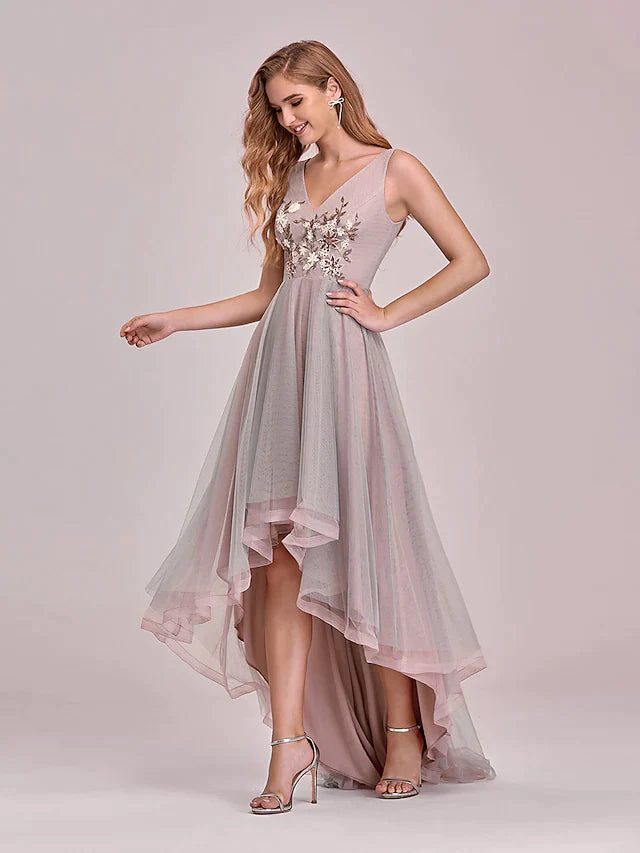 Back view of the V-neck asymmetrical tulle dress, featuring a graceful silhouette and floor-length skirt.