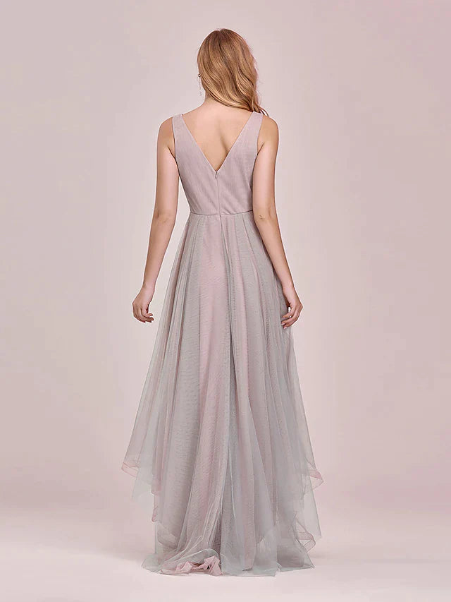 Close-up of the V-neck bodice and intricate floral appliques on the tulle bridesmaid dress.